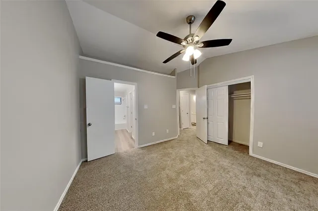 a view of an empty room and closet area