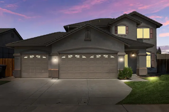 a view of a house with a small yard