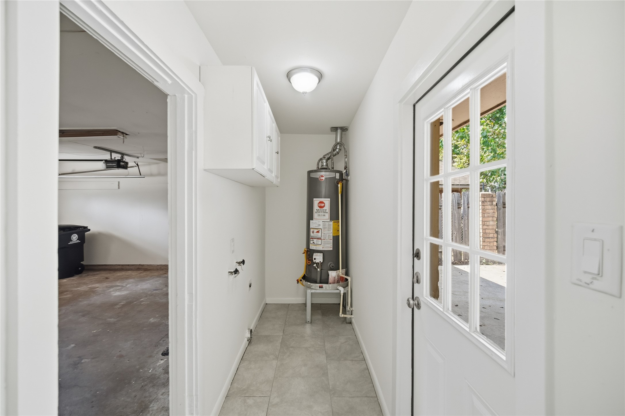 9524 Truscon Drive Houston, TX 77080 - Photo 21 of 30 a view of a hallway with wooden shelves and windows