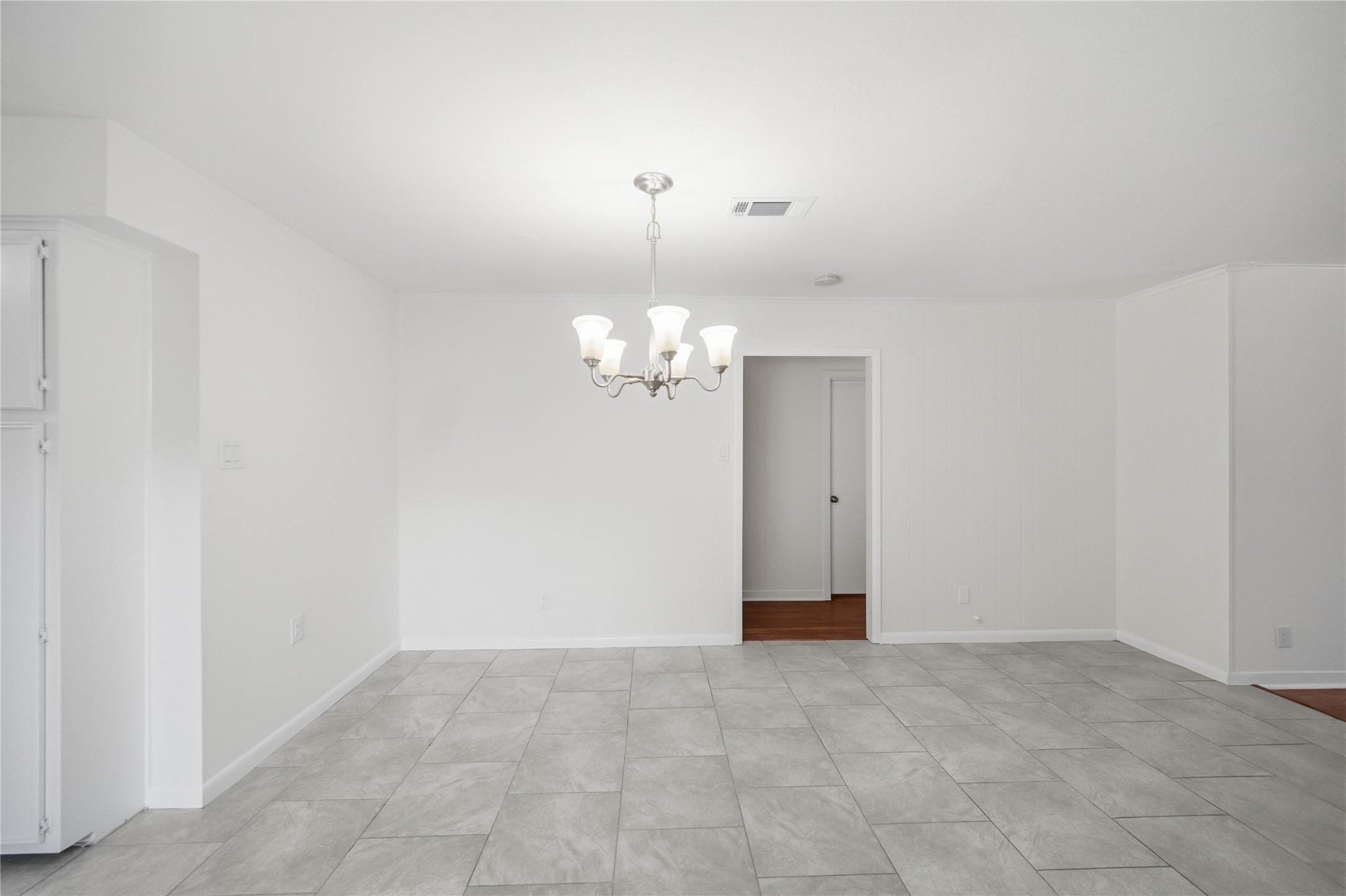 9524 Truscon Drive Houston, TX 77080 - Photo 6 of 30 a view of an empty room with chandelier fan