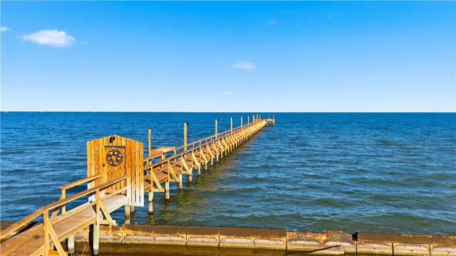 a view of swimming pool with seating area