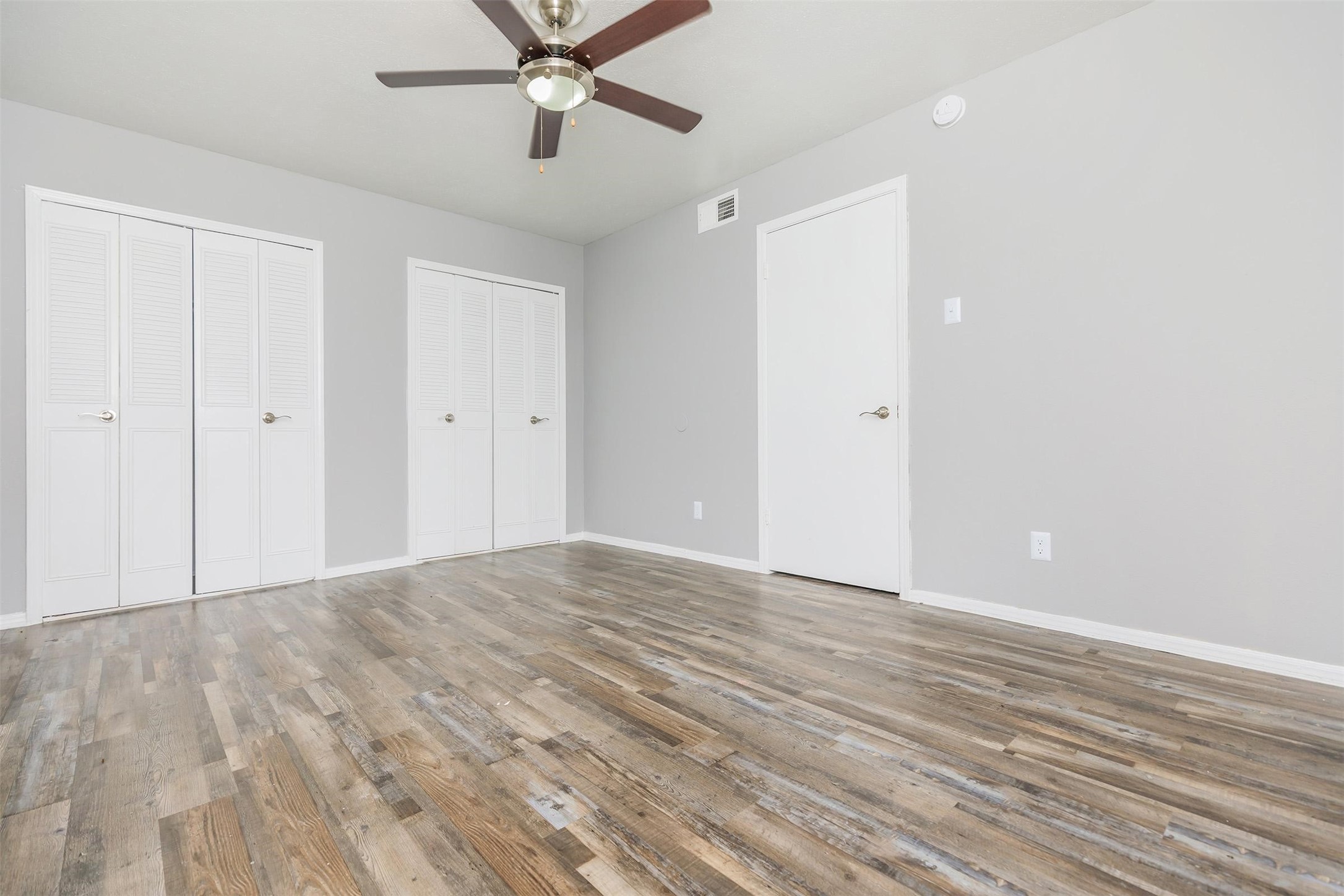 1212 Hampshire Lane, Unit 2091 Richardson, TX 75080 - Photo 18 of 40 a view of an empty room with wooden floor