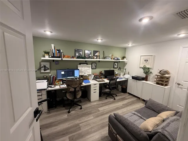 a work room with furniture and a workspace
