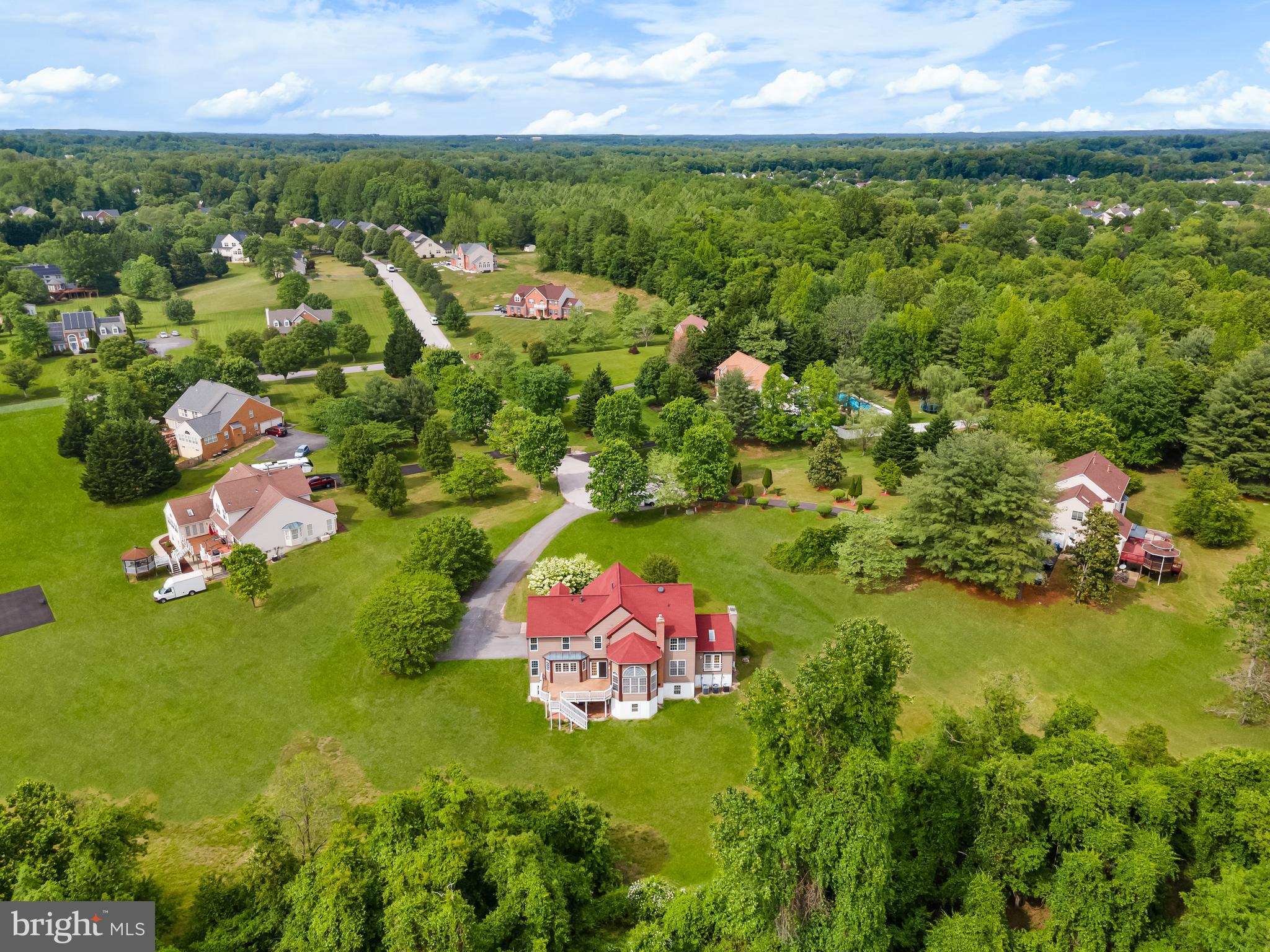 601 James Ridge Road Bowie, MD 20721 - Photo 17 of 77 an aerial view of residential houses with outdoor space and trees all around