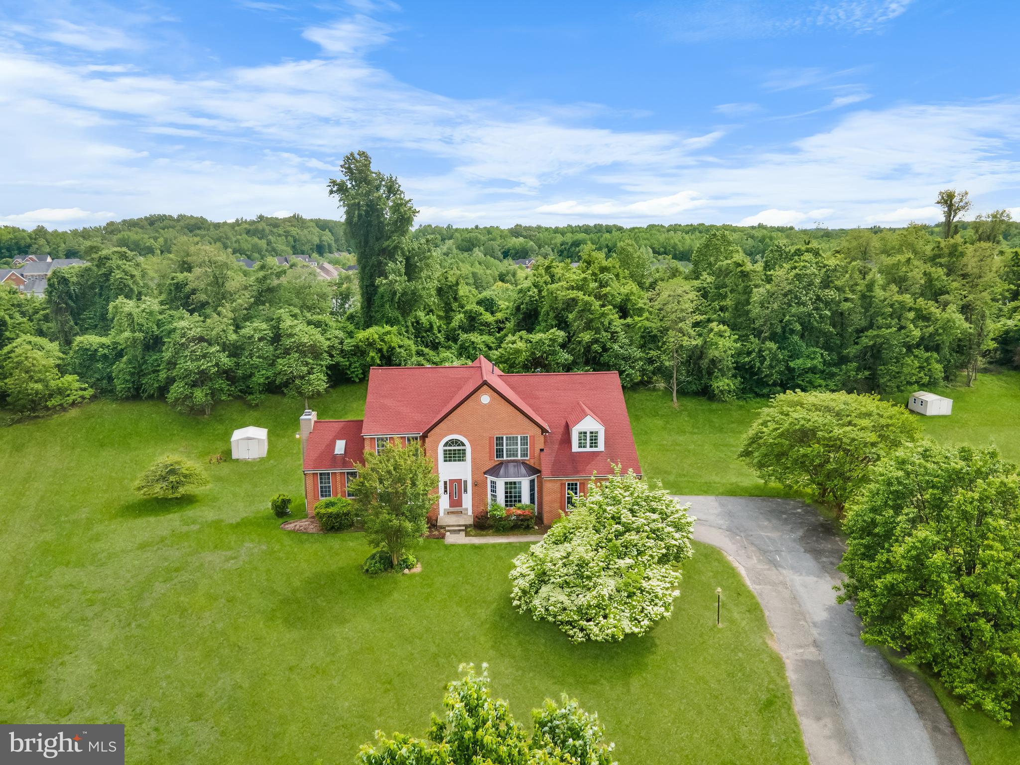 601 James Ridge Road Bowie, MD 20721 - Photo 2 of 77 a view of a house with a big yard and potted plants