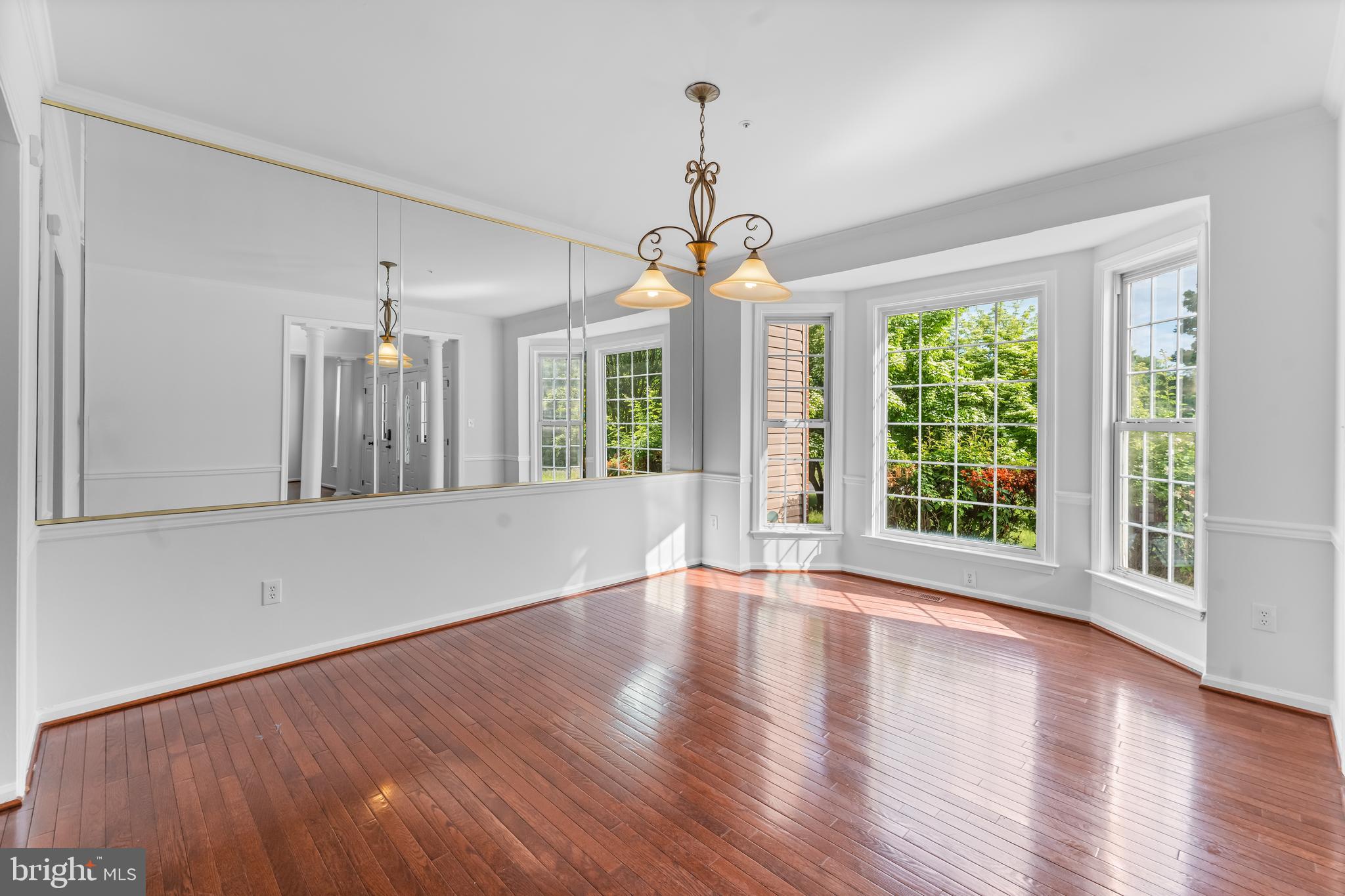 601 James Ridge Road Bowie, MD 20721 - Photo 23 of 77 a view of an empty room with wooden floor and a window
