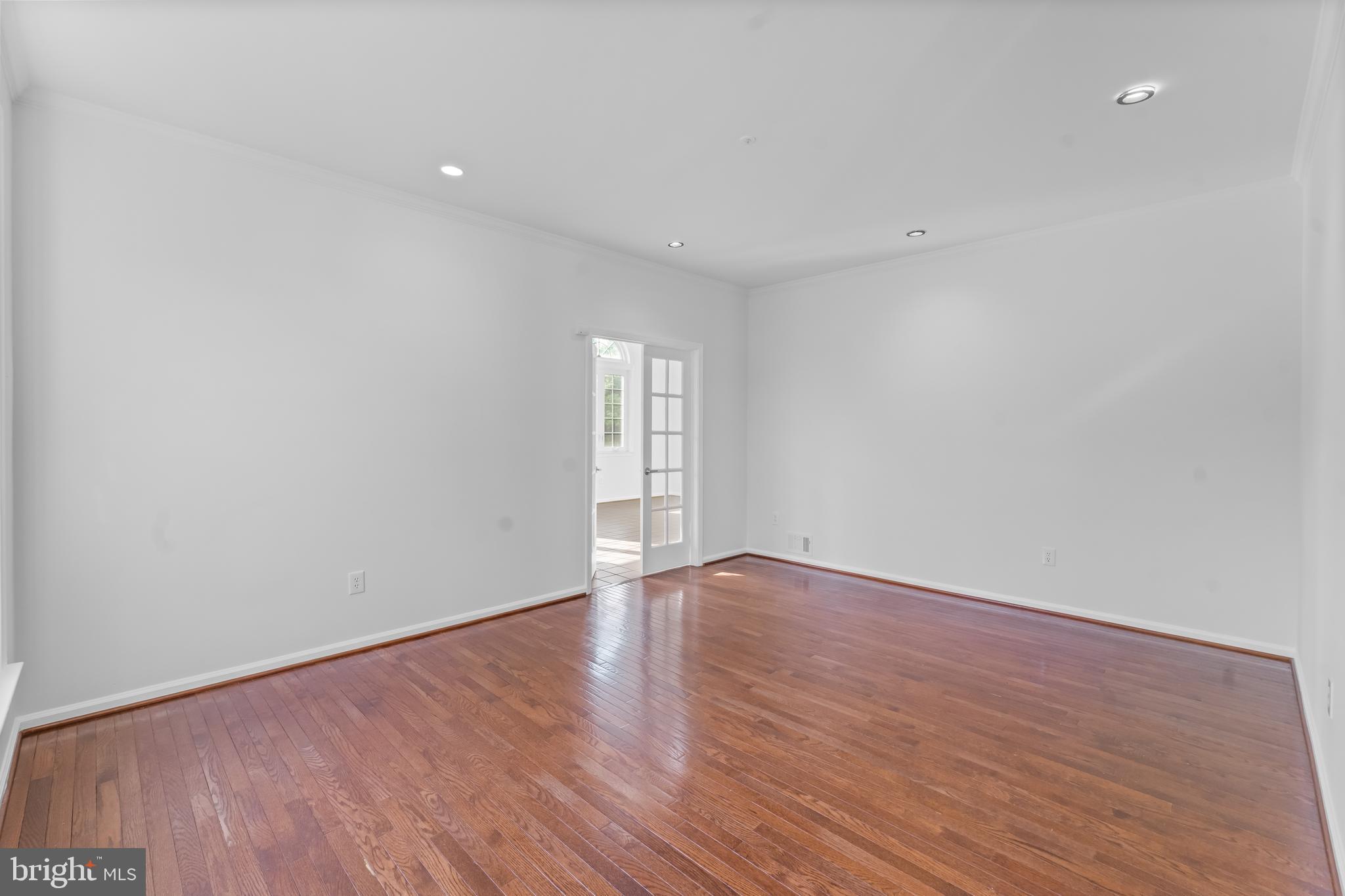 601 James Ridge Road Bowie, MD 20721 - Photo 25 of 77 a view of an empty room with wooden floor and window