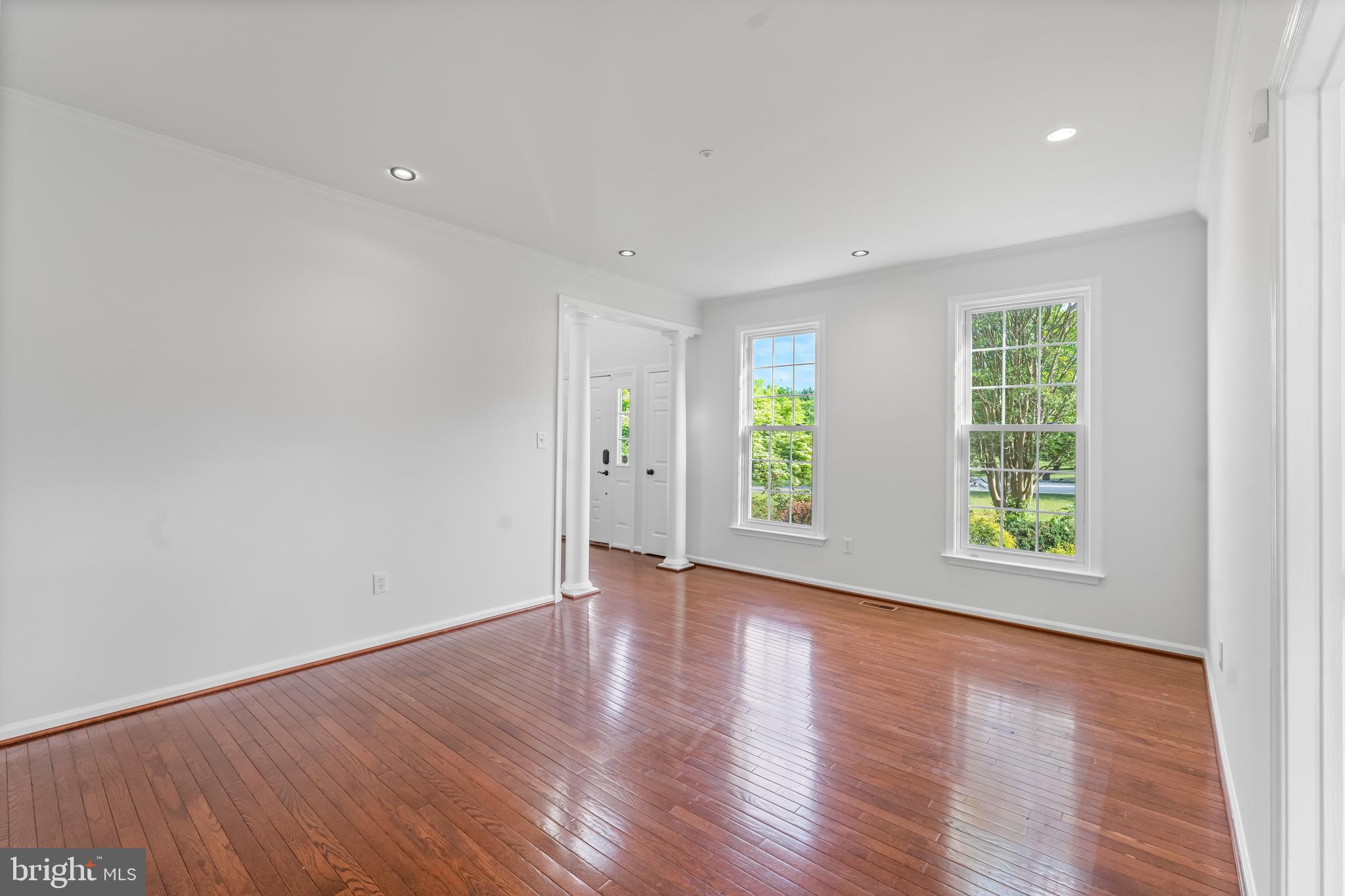 601 James Ridge Road Bowie, MD 20721 - Photo 26 of 77 an empty room with wooden floor and windows