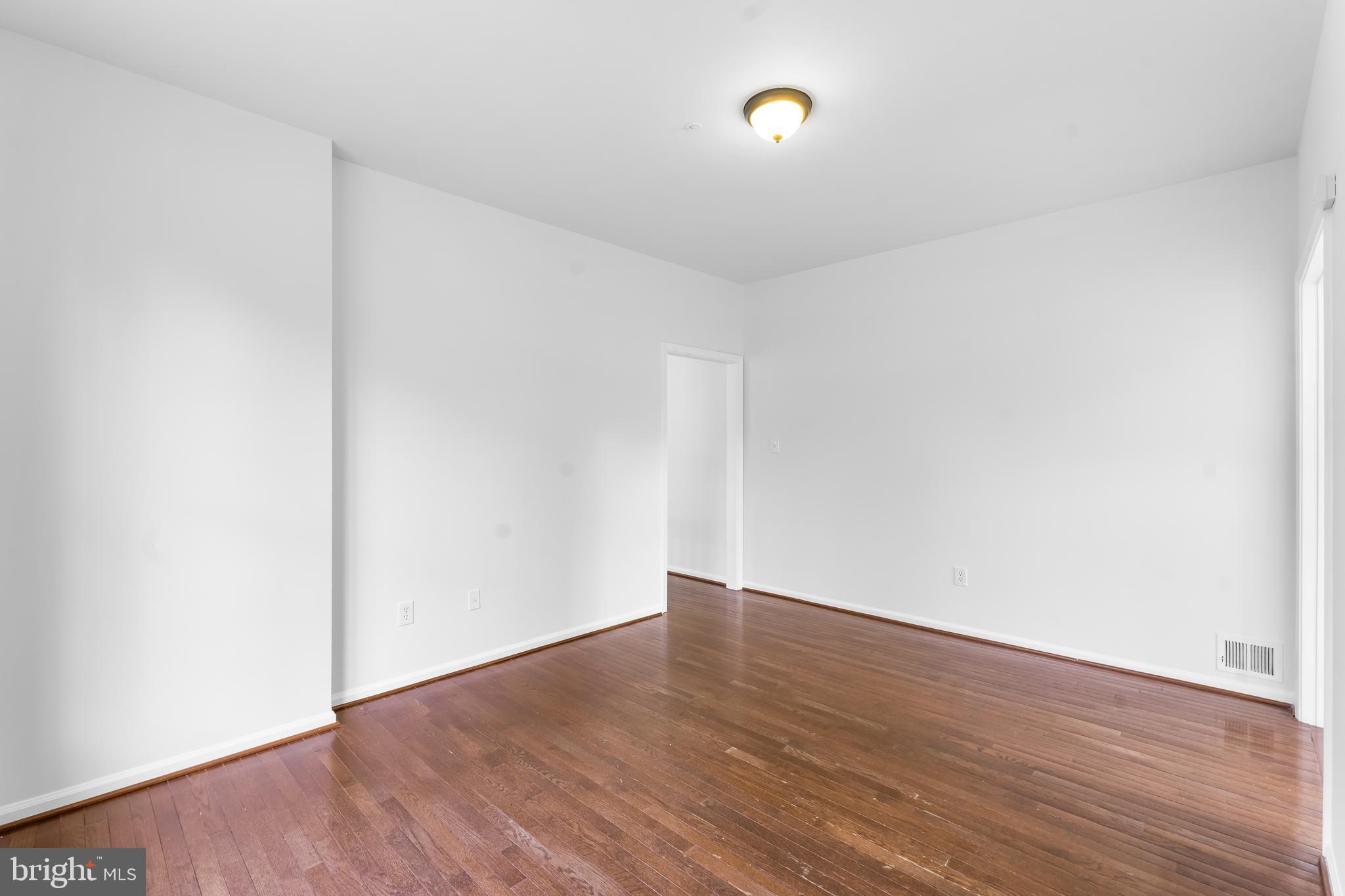 601 James Ridge Road Bowie, MD 20721 - Photo 30 of 77 a view of an empty room with wooden floor