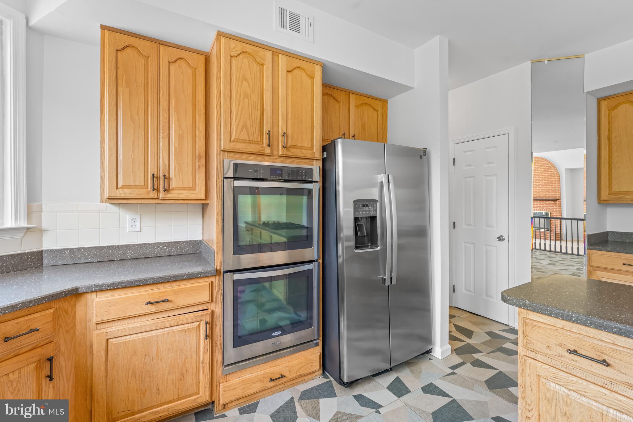 601 James Ridge Road Bowie, MD 20721 - Photo 40 of 77 a kitchen with stainless steel appliances granite countertop a refrigerator and a sink
