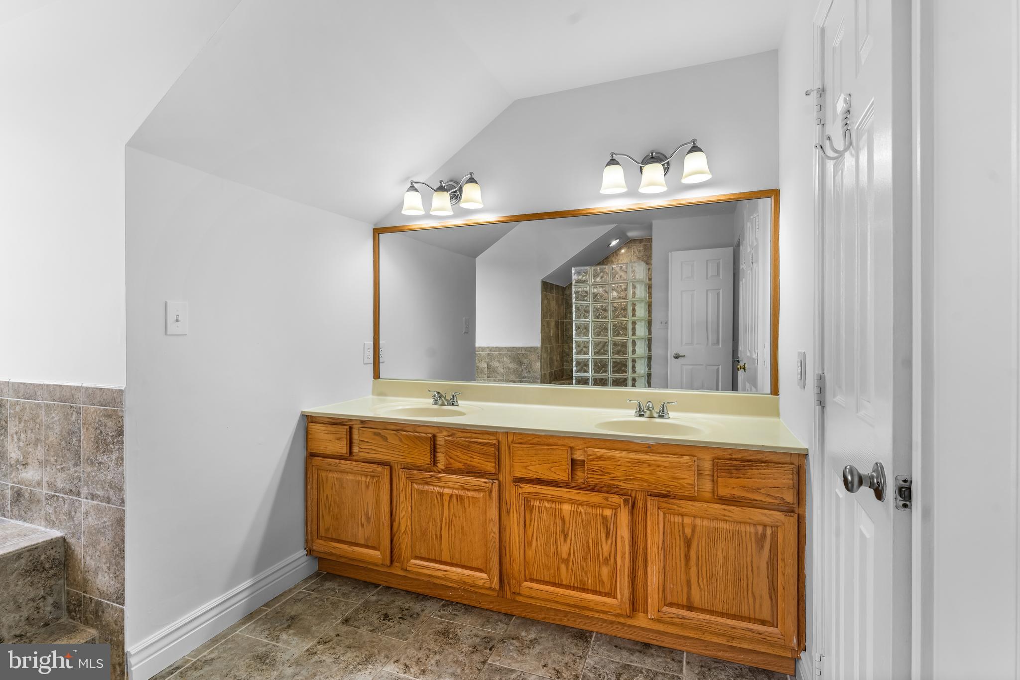 601 James Ridge Road Bowie, MD 20721 - Photo 48 of 77 a bathroom with a sink and a mirror