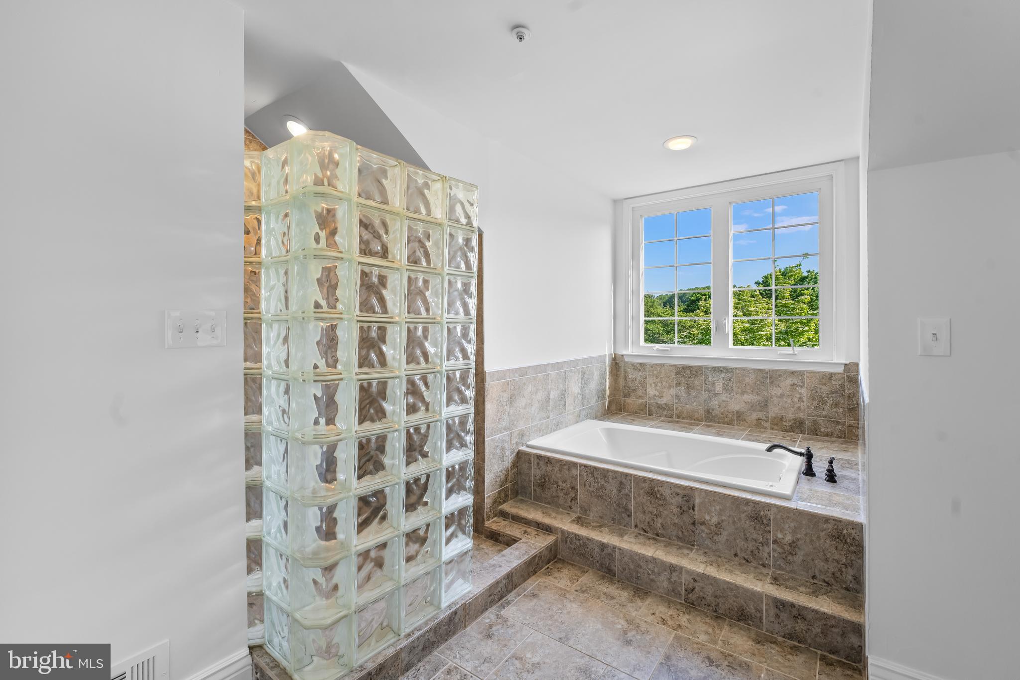 601 James Ridge Road Bowie, MD 20721 - Photo 49 of 77 a bathroom with a bathtub and a shower