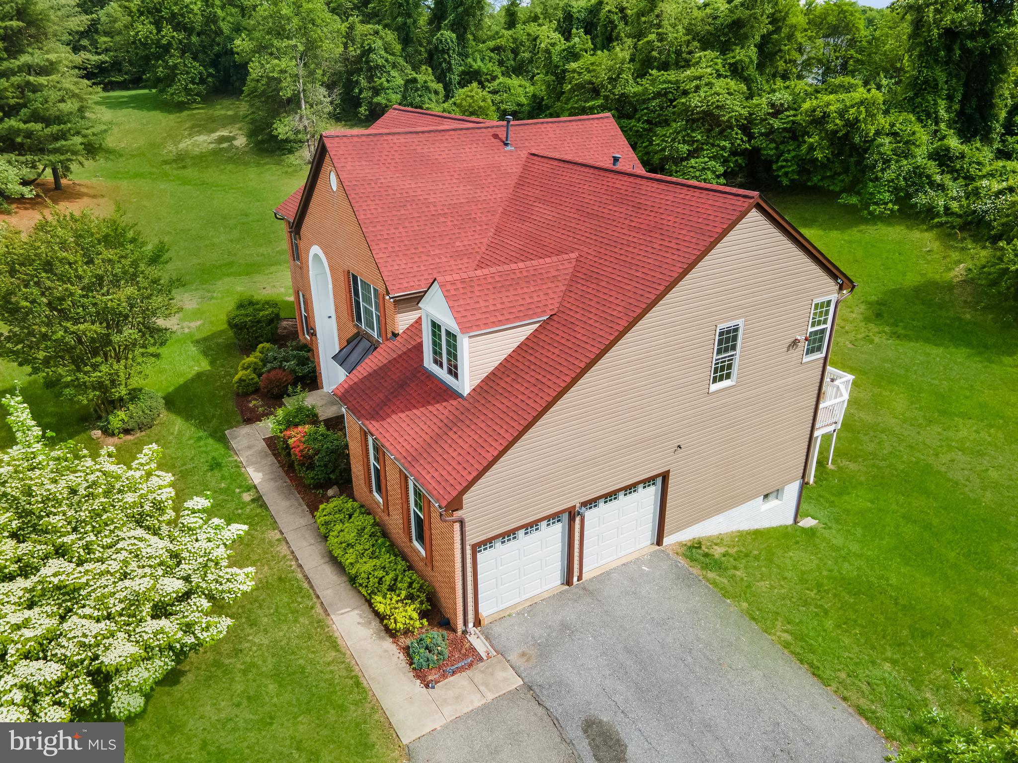 601 James Ridge Road Bowie, MD 20721 - Photo 7 of 77 a aerial view of a house with a yard and potted plants