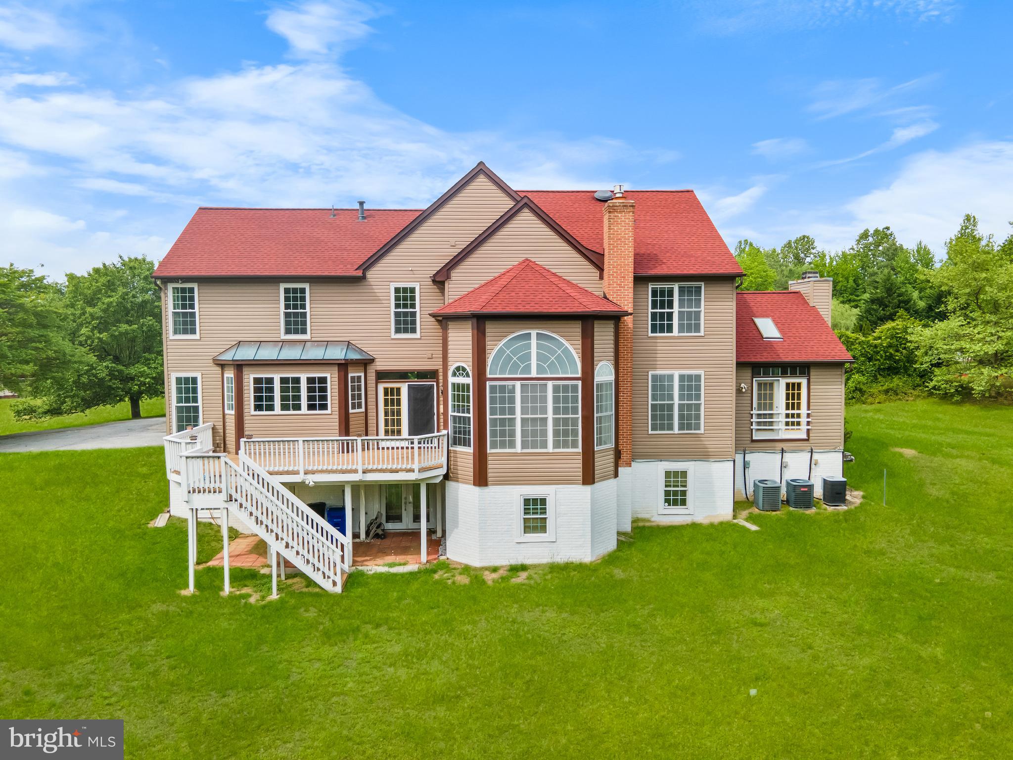 601 James Ridge Road Bowie, MD 20721 - Photo 76 of 77 a front view of a house with a yard table and chairs