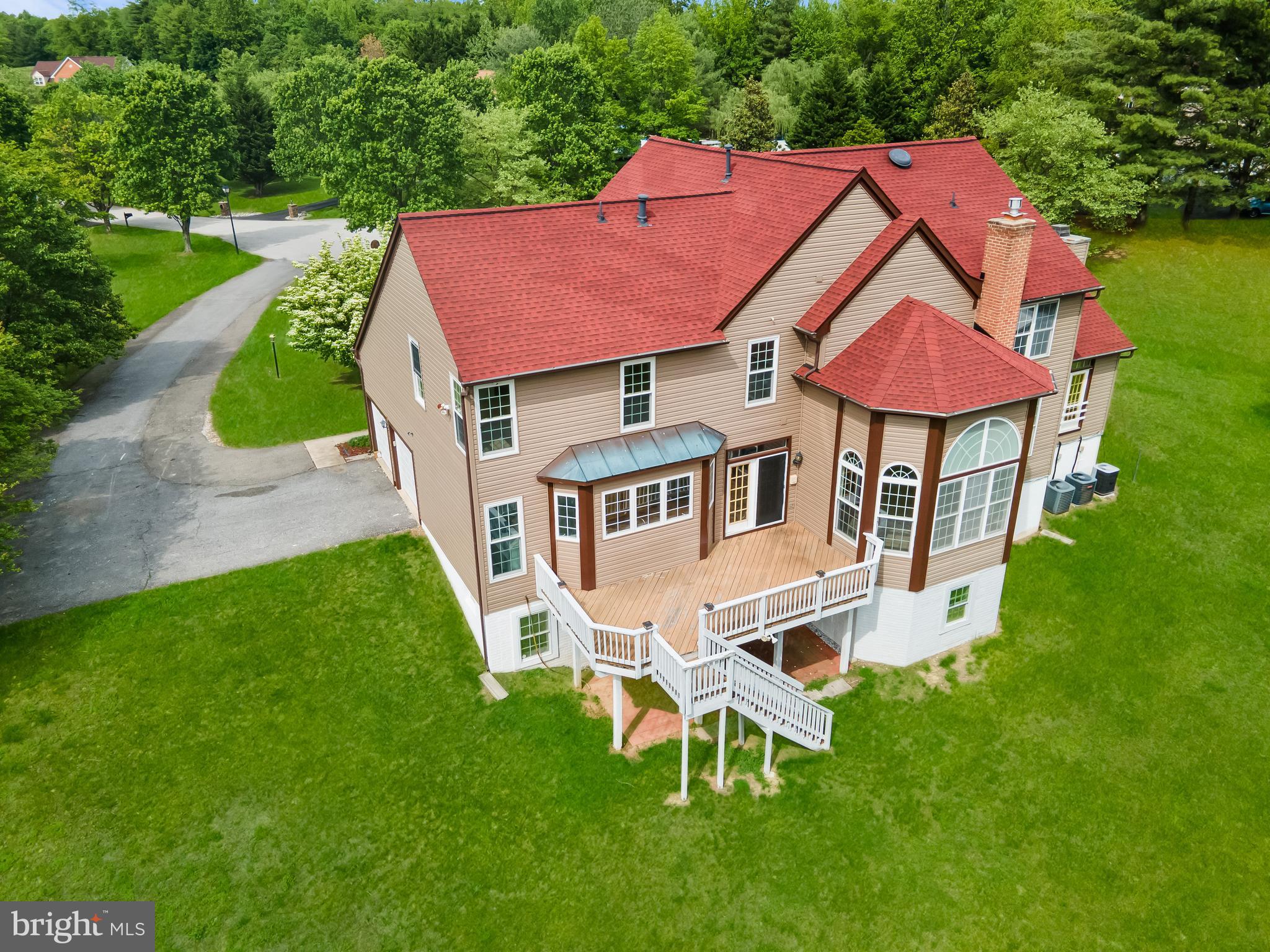 601 James Ridge Road Bowie, MD 20721 - Photo 9 of 77 a aerial view of a house with a yard table and chairs