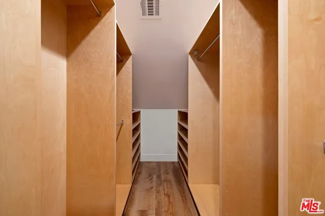 a view of a hallway with stairs