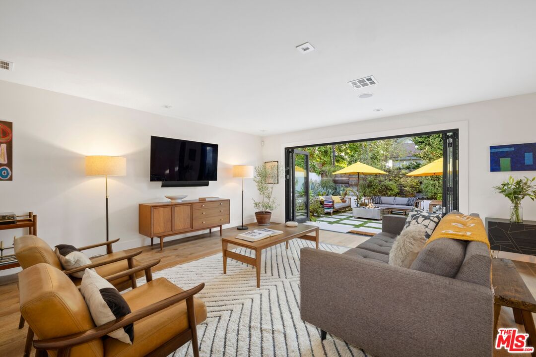 967 Vernon Avenue Venice, CA 90291 - Photo 5 of 22 a living room with furniture and a flat screen tv