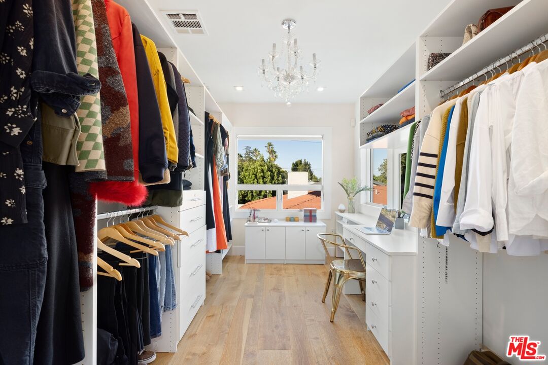 967 Vernon Avenue Venice, CA 90291 - Photo 10 of 22 a view of walk in closet with clothes and shoes