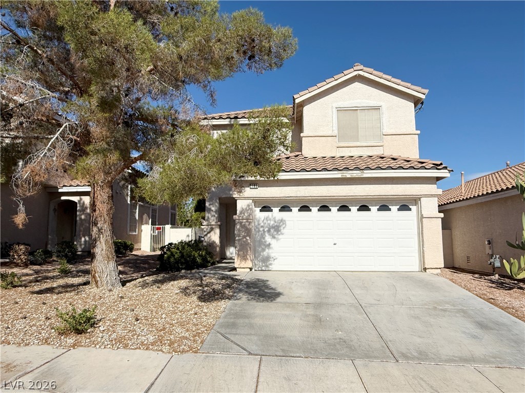 2185 Polynesia Circle Henderson, NV 89074 - Photo 1 of 37 A well-maintained facade with an integrated garage and desert-friendly landscaping.