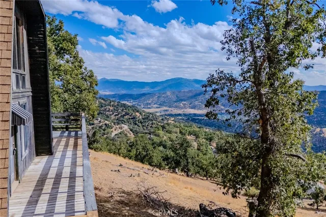 a view of a backyard of the house