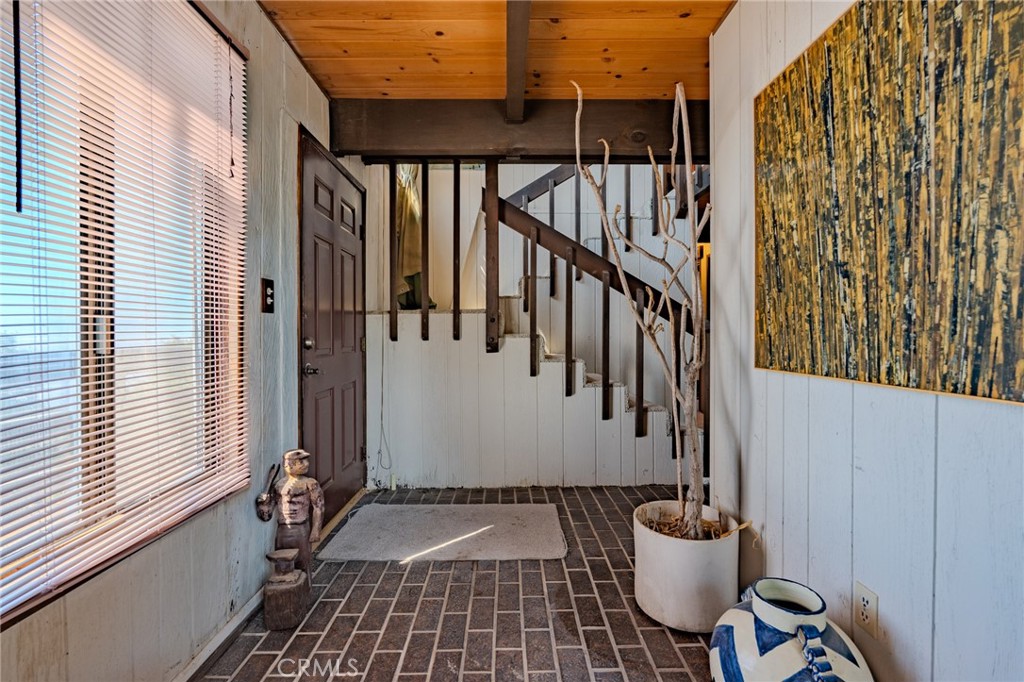 27380 Deertrail Drive Tehachapi, CA 93561 - Photo 16 of 47 a view of an entryway with wooden floor and stairs