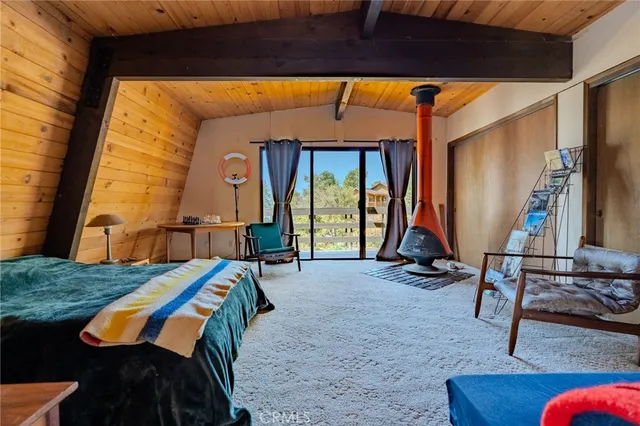 a view of living room with furniture and floor to ceiling window