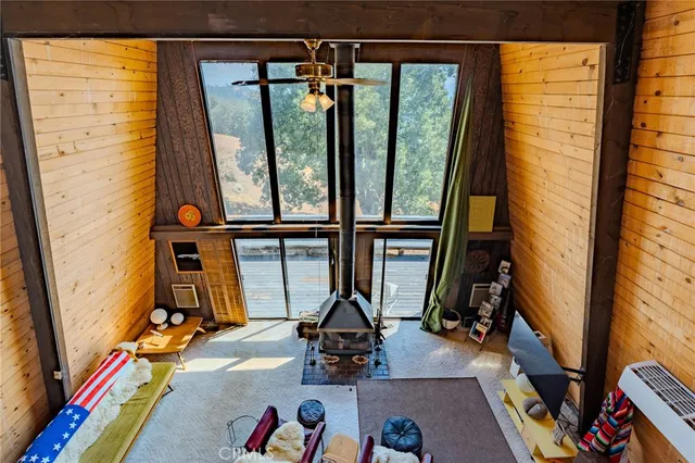 a view of living room with furniture and floor to ceiling window