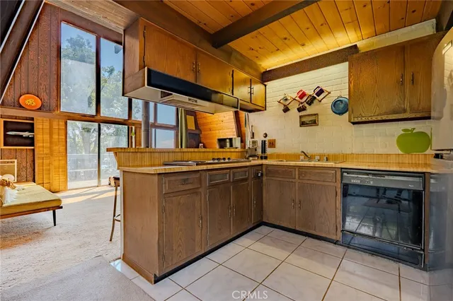 a kitchen with stainless steel appliances granite countertop a sink and a cabinets