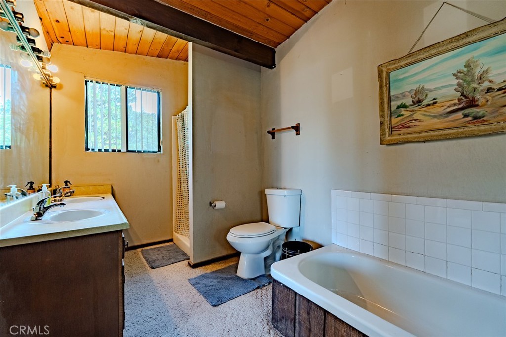 27380 Deertrail Drive Tehachapi, CA 93561 - Photo 39 of 47 a bathroom with a sink toilet and shower
