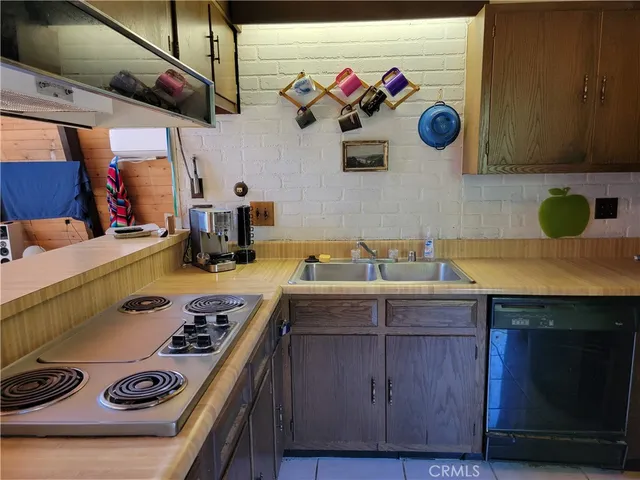 a kitchen with a stove and cabinets