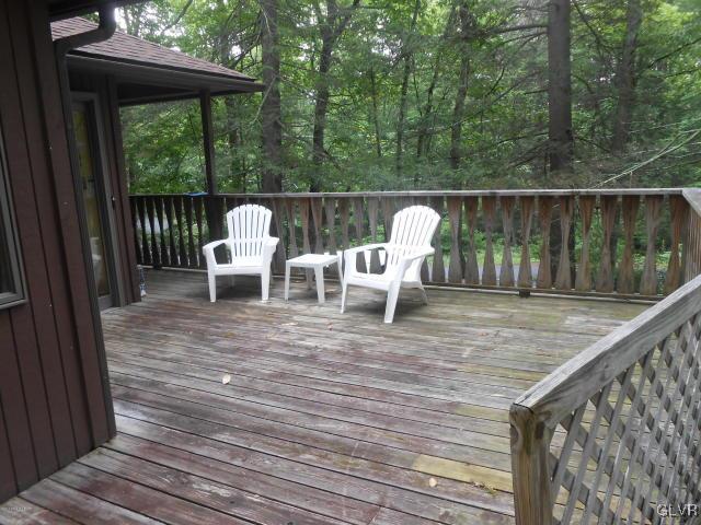 3497 Spruce Cabin Road Cresco, PA 18326 - Photo 15 of 22 a view of deck with chairs and wooden fence