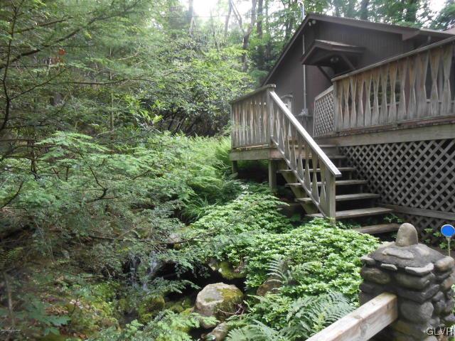 3497 Spruce Cabin Road Cresco, PA 18326 - Photo 19 of 22 a backyard of a house with lots of green space