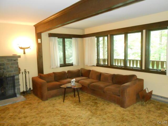 3497 Spruce Cabin Road Cresco, PA 18326 - Photo 4 of 22 a living room with furniture and a large window