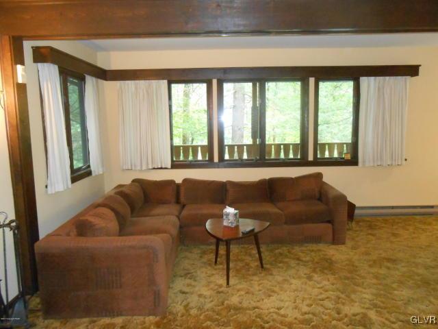 3497 Spruce Cabin Road Cresco, PA 18326 - Photo 5 of 22 a living room with furniture and a large window