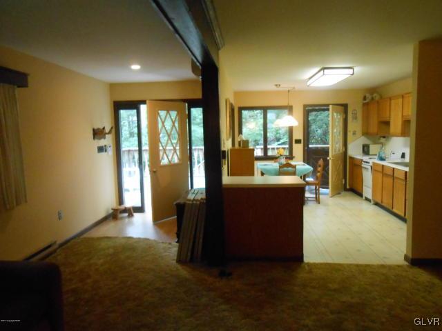 3497 Spruce Cabin Road Cresco, PA 18326 - Photo 6 of 22 a living room with furniture and large windows