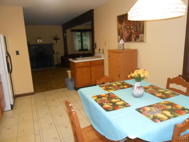 3497 Spruce Cabin Road Cresco, PA 18326 - Photo 7 of 22 a dining room with furniture and a wooden floor