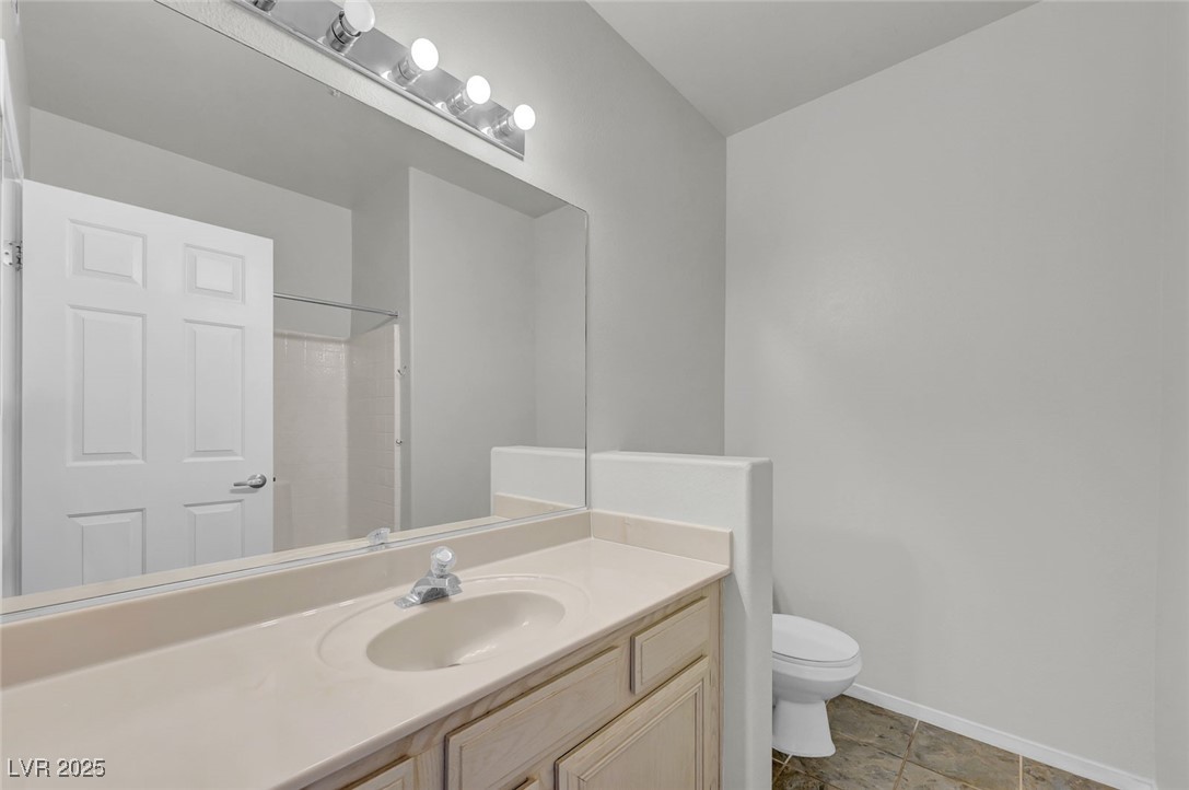 7147 South Durango Drive, Unit 304 Las Vegas, NV 89113 - Photo 15 of 27 Bathroom with vanity and a shower