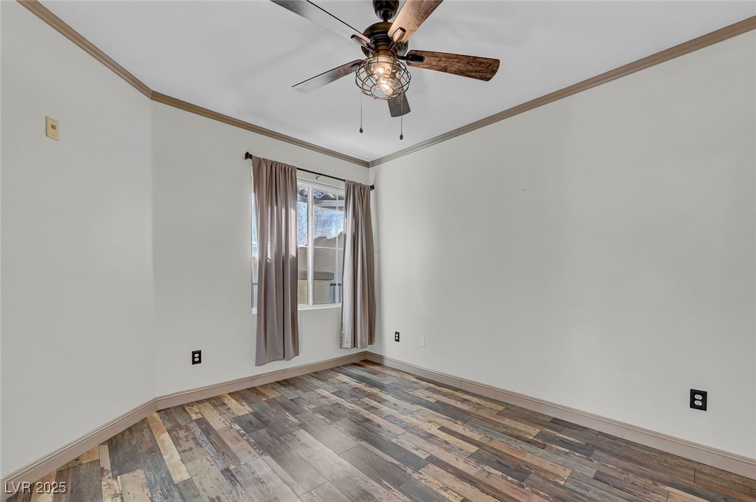 7147 South Durango Drive, Unit 304 Las Vegas, NV 89113 - Photo 19 of 27 Unfurnished room with crown molding, wood finished floors, and a ceiling fan