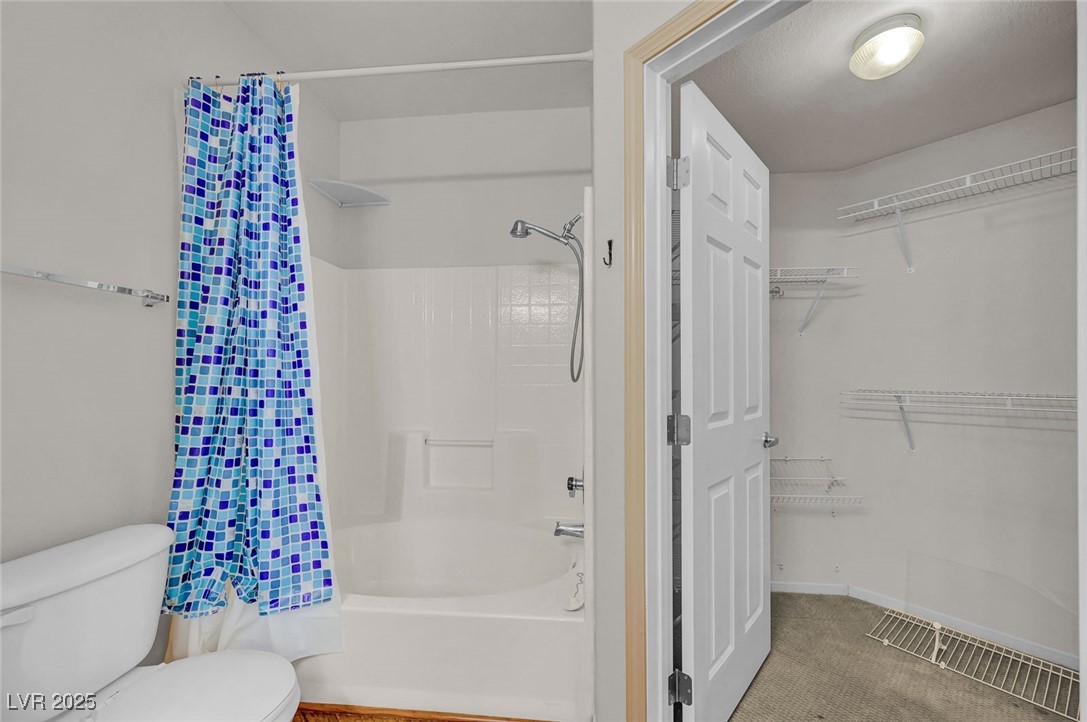 7147 South Durango Drive, Unit 304 Las Vegas, NV 89113 - Photo 22 of 27 Full bathroom featuring shower / tub combo and a spacious closet