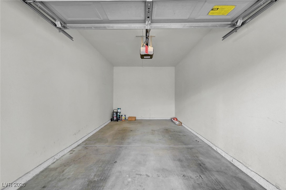 7147 South Durango Drive, Unit 304 Las Vegas, NV 89113 - Photo 26 of 27 Garage with a garage door opener
