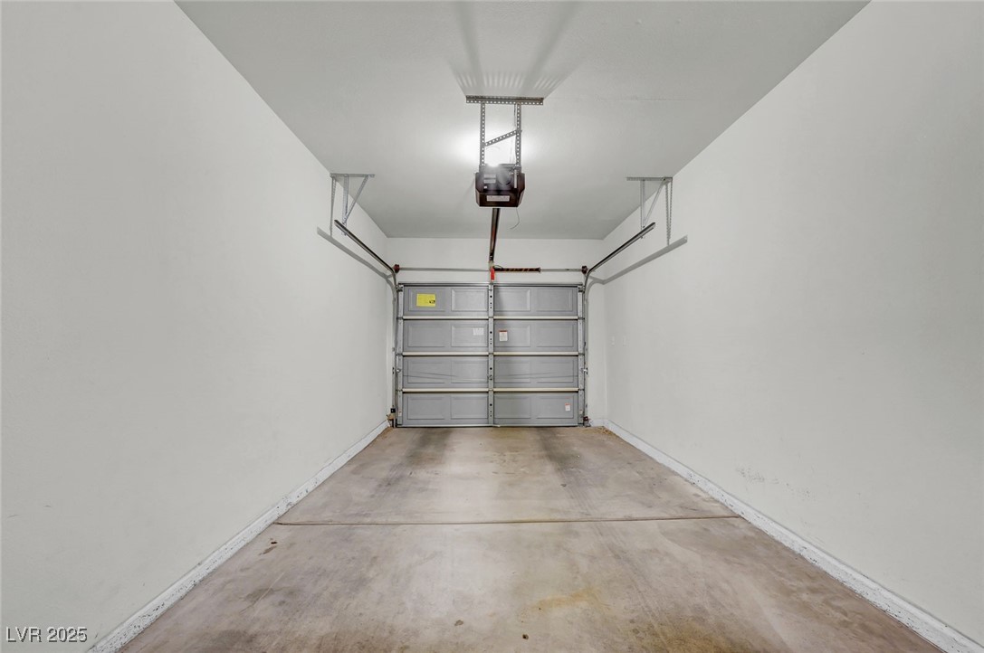 7147 South Durango Drive, Unit 304 Las Vegas, NV 89113 - Photo 27 of 27 Garage with a garage door opener
