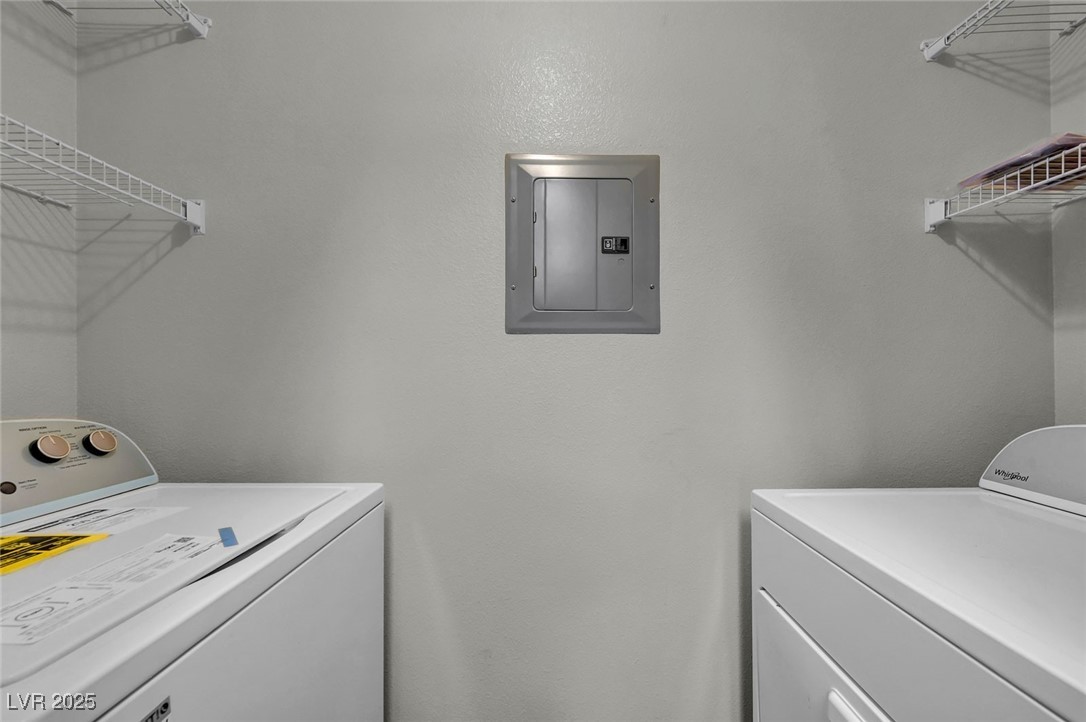 7147 South Durango Drive, Unit 304 Las Vegas, NV 89113 - Photo 8 of 27 Washroom with washer and clothes dryer and electric panel