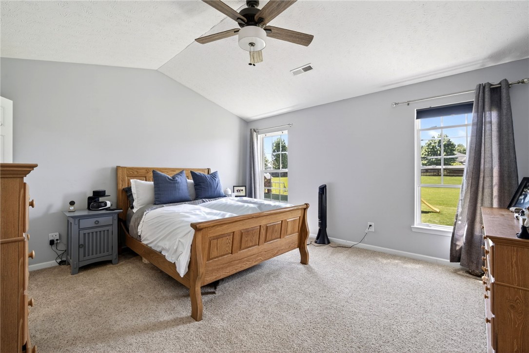 39 Holly Court Springboro, OH 45066 - Photo 20 of 42 This spacious bedroom offers ample natural light and vaulted ceilings.