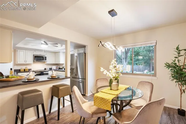 a dining room with furniture and window