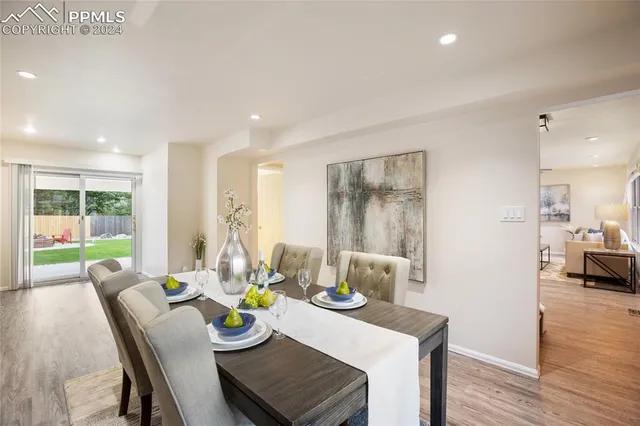 a view of a dining room with furniture window and wooden floor