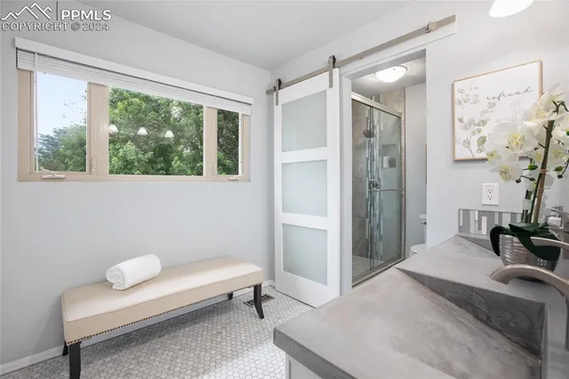 a bedroom with a bed and a couch