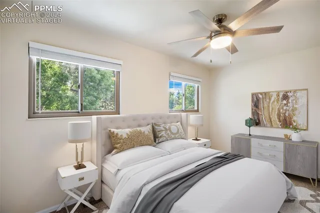 a bedroom with a large bed and a window