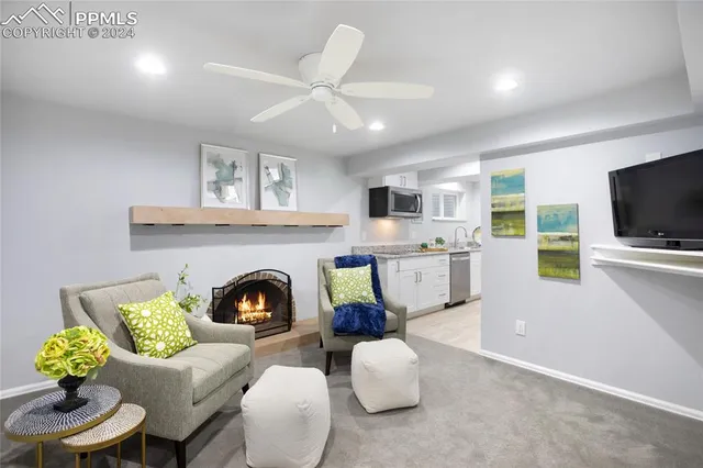 a living room with furniture and a fireplace