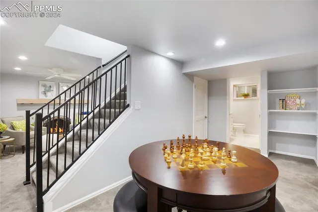 a view of a livingroom with a dinning room and stairs