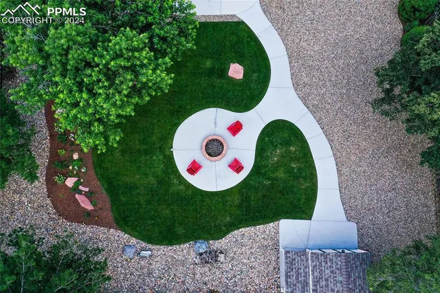 a garden with plants and wooden fence